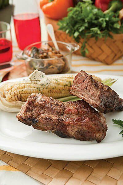 Costilla de cerdo y elotes asados